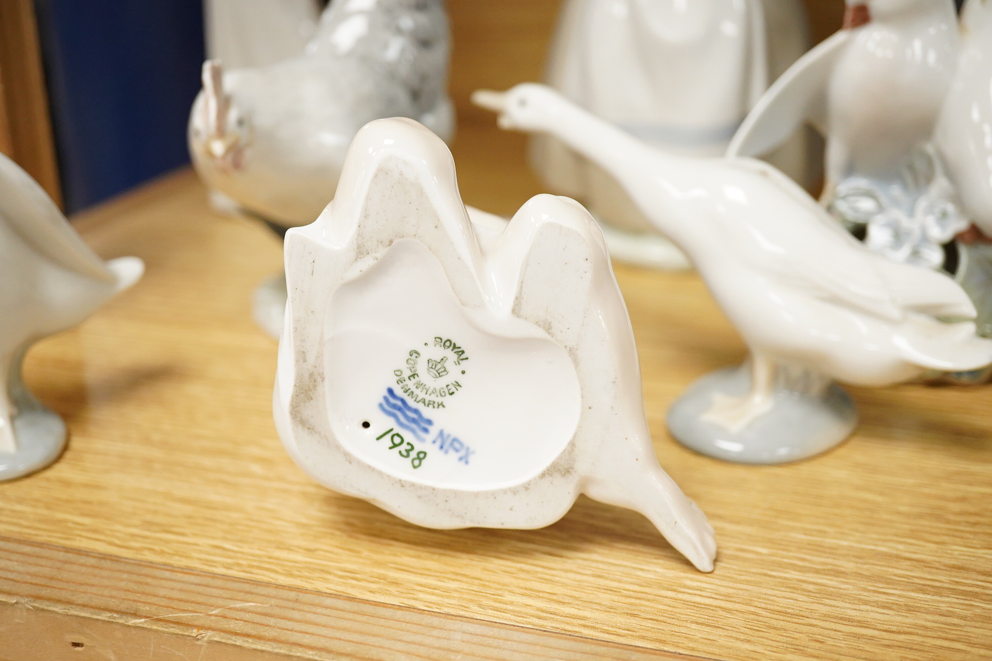 A group of Copenhagen, Nao and Lladro figures to include birds, together with a Royal Copenhagen vase, largest 21cm high